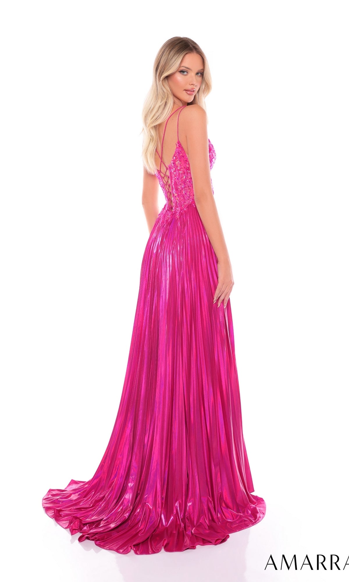 A woman stands against a white background wearing the Long Formal Dress 88113 by Amarra, a shiny, floor-length metallic gown featuring a fitted bodice and thin straps.
